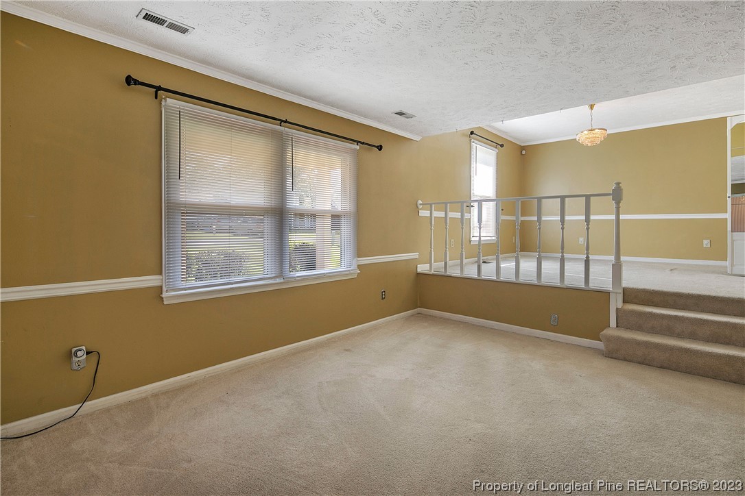 6875 Baystone Road Fayetteville, NC 28314 - Photo 7 of 50 a view of an empty room with a window