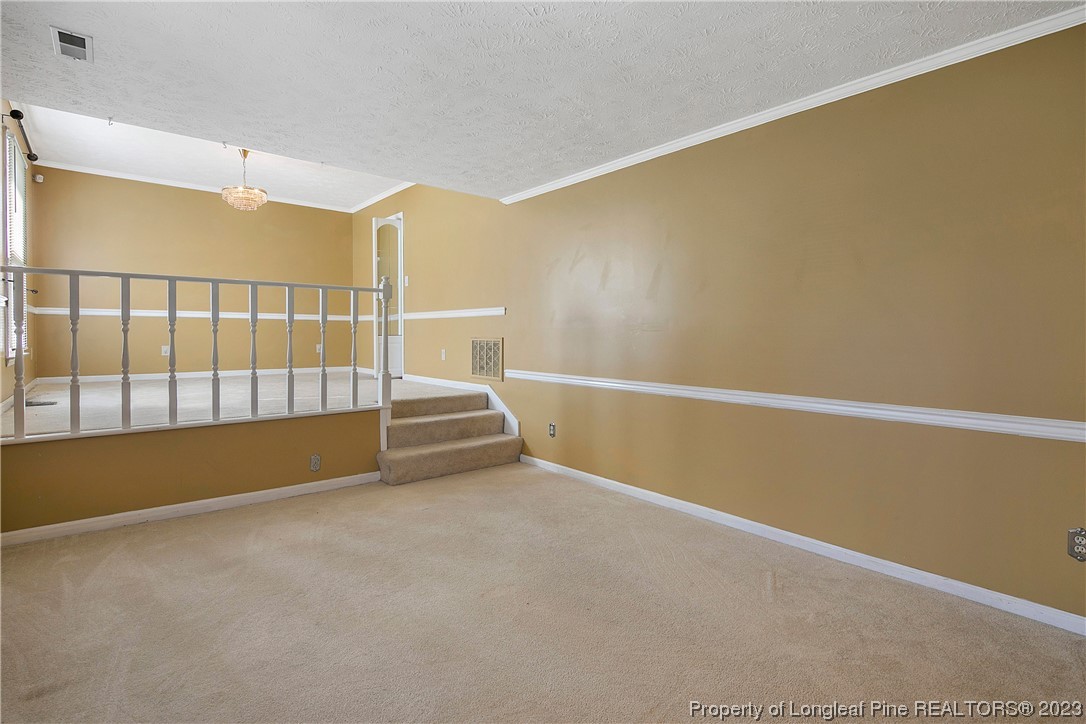 6875 Baystone Road Fayetteville, NC 28314 - Photo 8 of 50 a view of an empty room with windows