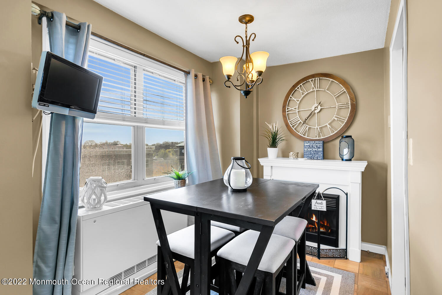 28 Riverside Avenue, Unit 4D Red Bank, NJ 07701 - Photo 3 of 20 a view of a dining room with furniture a chandelier and a wooden floor