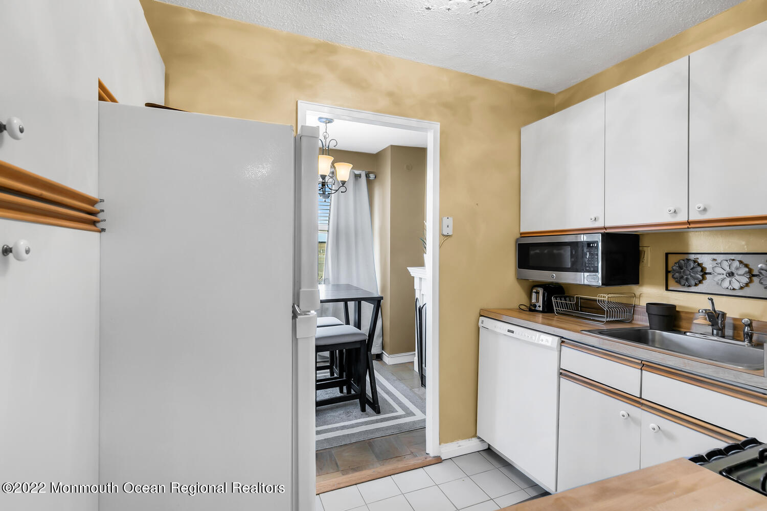 28 Riverside Avenue, Unit 4D Red Bank, NJ 07701 - Photo 8 of 20 a kitchen with a sink and cabinets