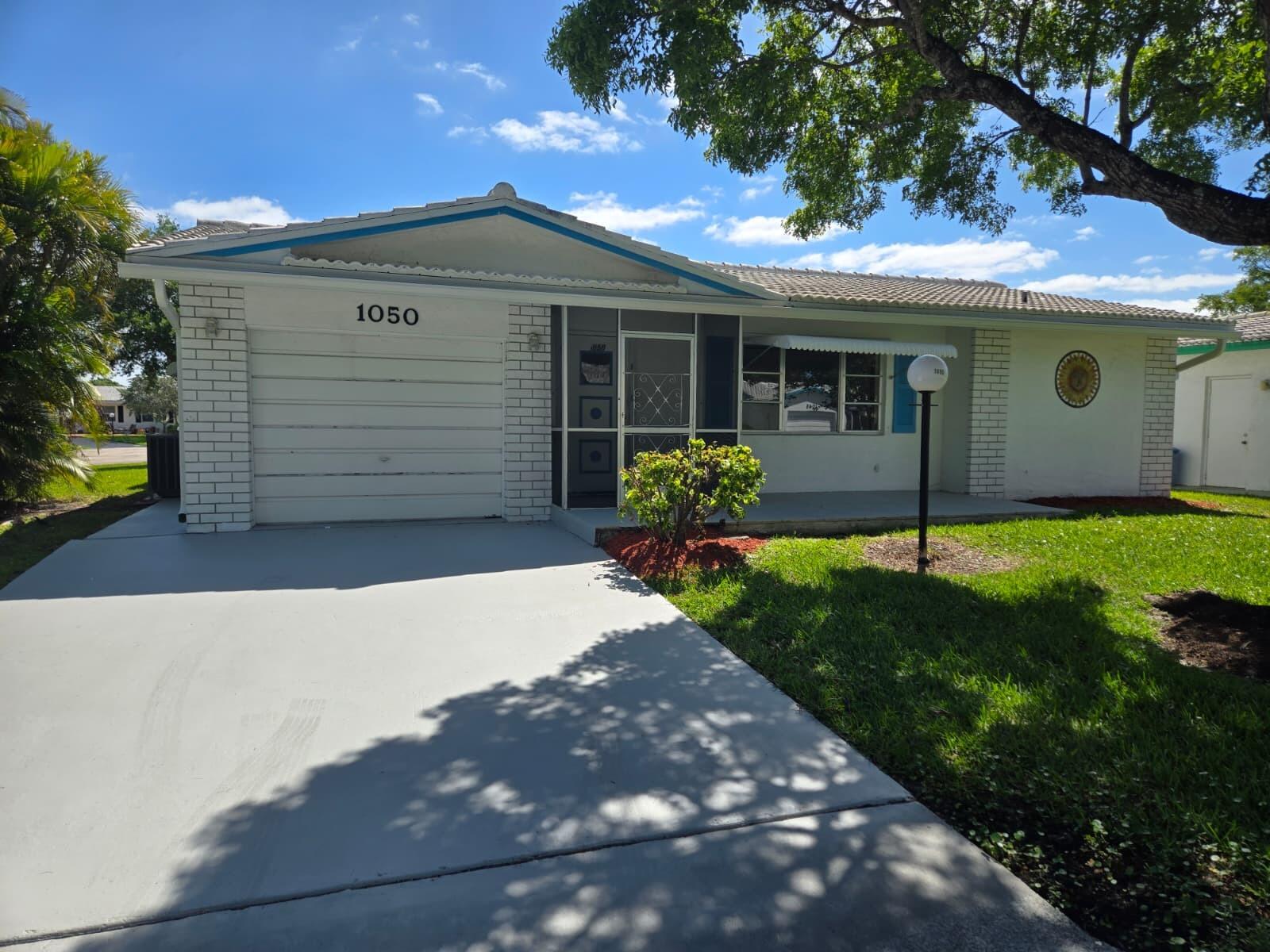 1050 Northwest 90th Way Plantation, FL 33322 - Photo 1 of 37 FRONT PIC NEW AND NICE