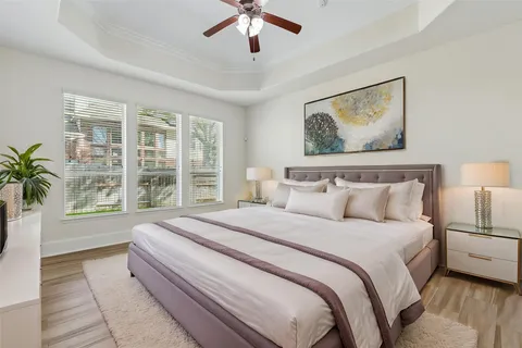 a bedroom with a large bed and a window
