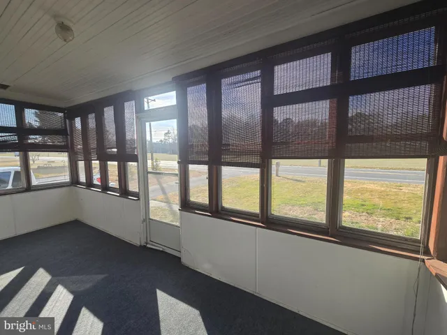 a view of an empty room with a large window