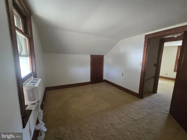 a view of a hallway with closet