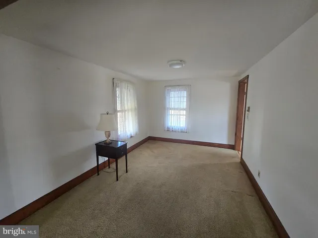 a view of a livingroom with furniture and window