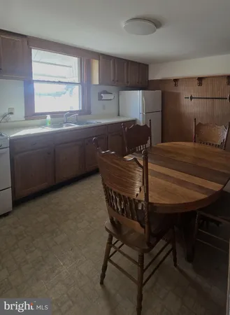 a kitchen with cabinets and stainless steel appliances