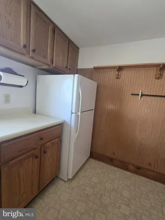 a stove top oven sitting inside of a kitchen