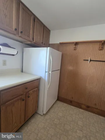 a stove top oven sitting inside of a kitchen