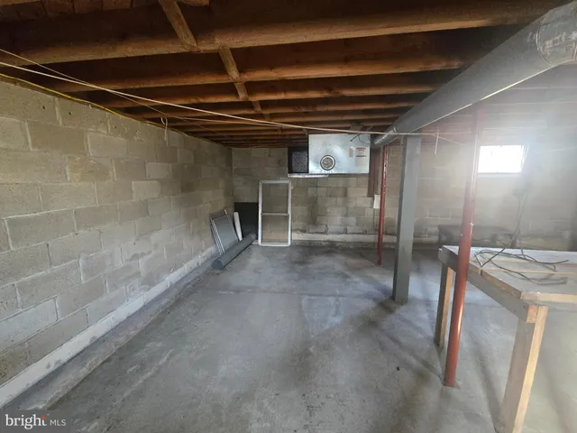 a view of an empty room with wooden walls