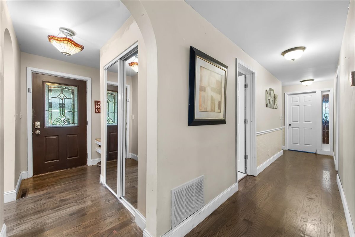 26 Glen Echo Road Elgin, IL 60120 - Photo 2 of 34 a view of a hallway with wooden floor and closet