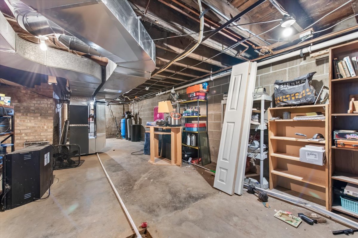 26 Glen Echo Road Elgin, IL 60120 - Photo 21 of 34 a view of water heater room with refrigerator