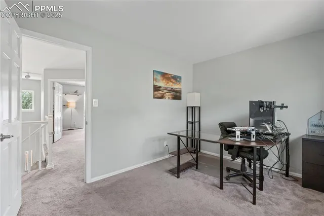 a view of a workspace with furniture