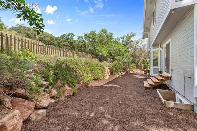 a backyard of a house with lots of green space