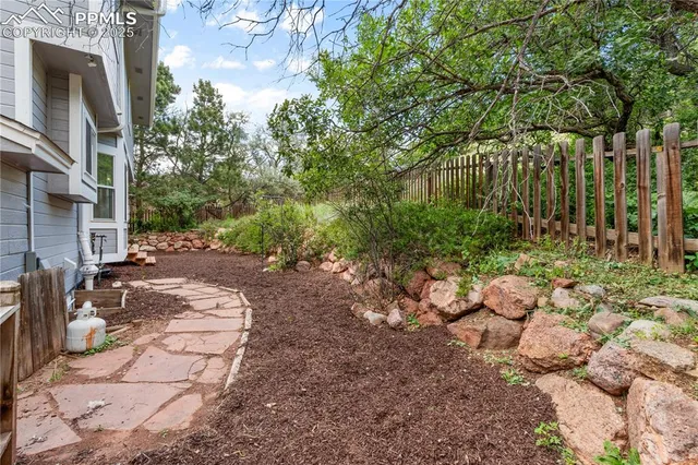 a view of a pathway with a yard
