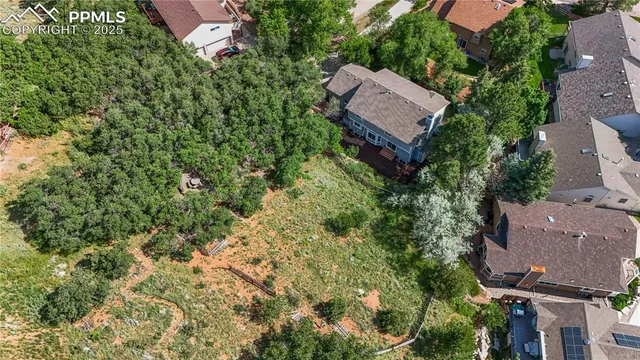 an aerial view of a house with a garden