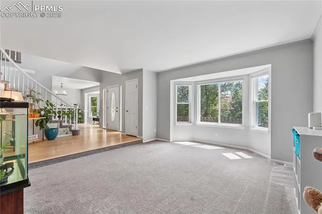 a view of a livingroom with wooden floor and a couch