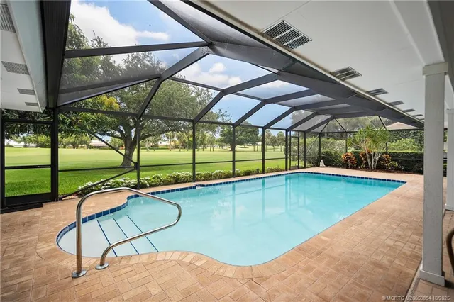 a view of swimming pool with a backyard