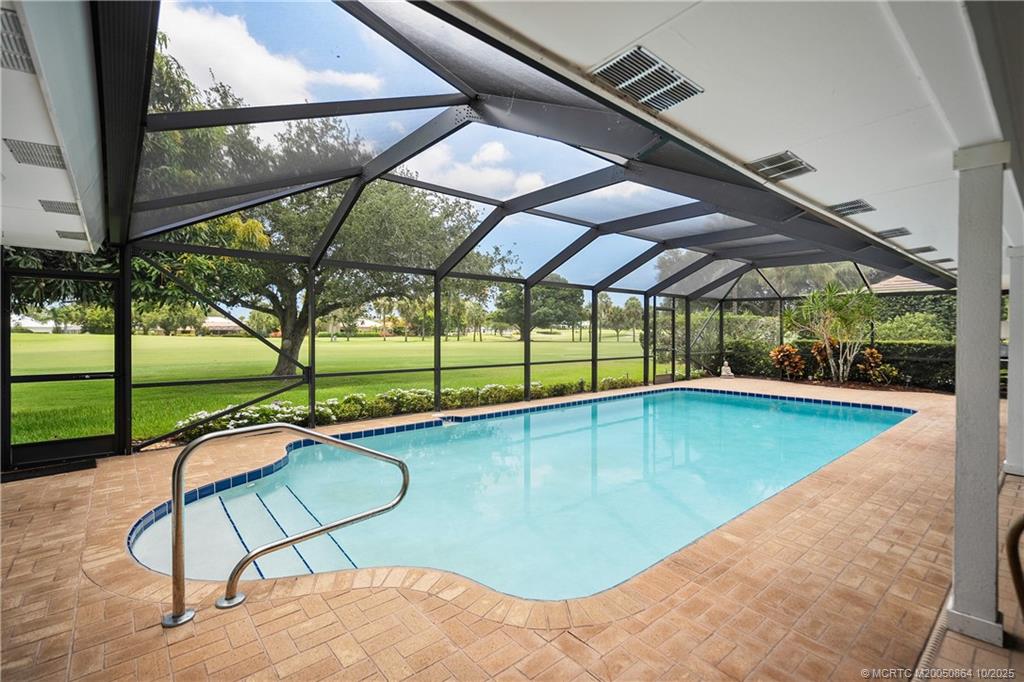 a view of swimming pool with a backyard
