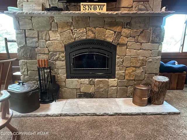 a living room with a couch and a fireplace