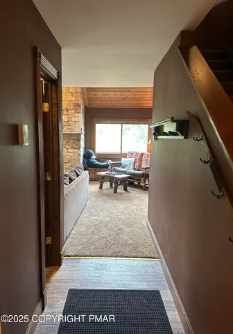 a view of living room with furniture and a rug