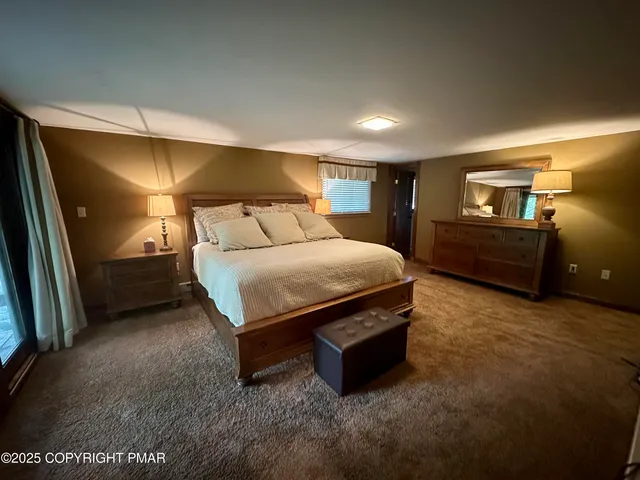 a room with a washing machine and cabinets