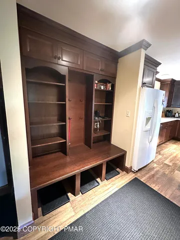 a view of kitchen with cabinets and wooden floor