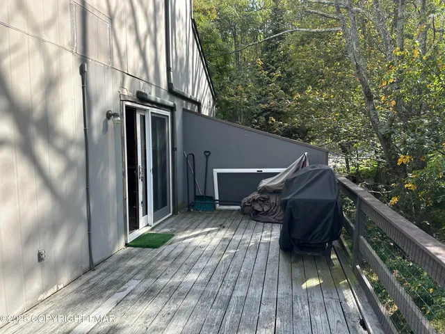 a backyard of a house with wooden floor yard and outdoor seating