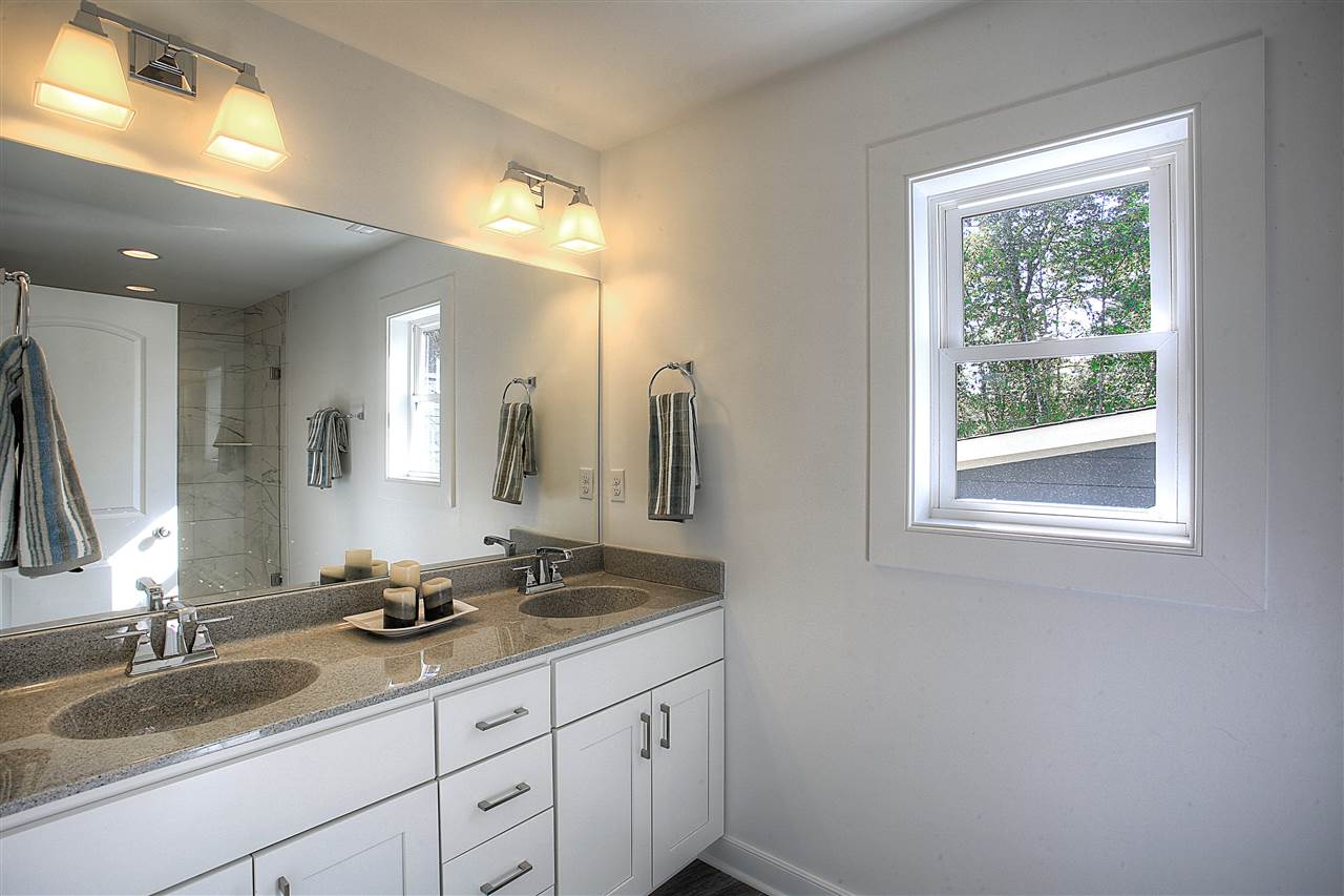 306 Guildford Farm Road Ruckersville, VA 22968 - Photo 24 of 29 a bathroom with a double vanity sink and a mirror