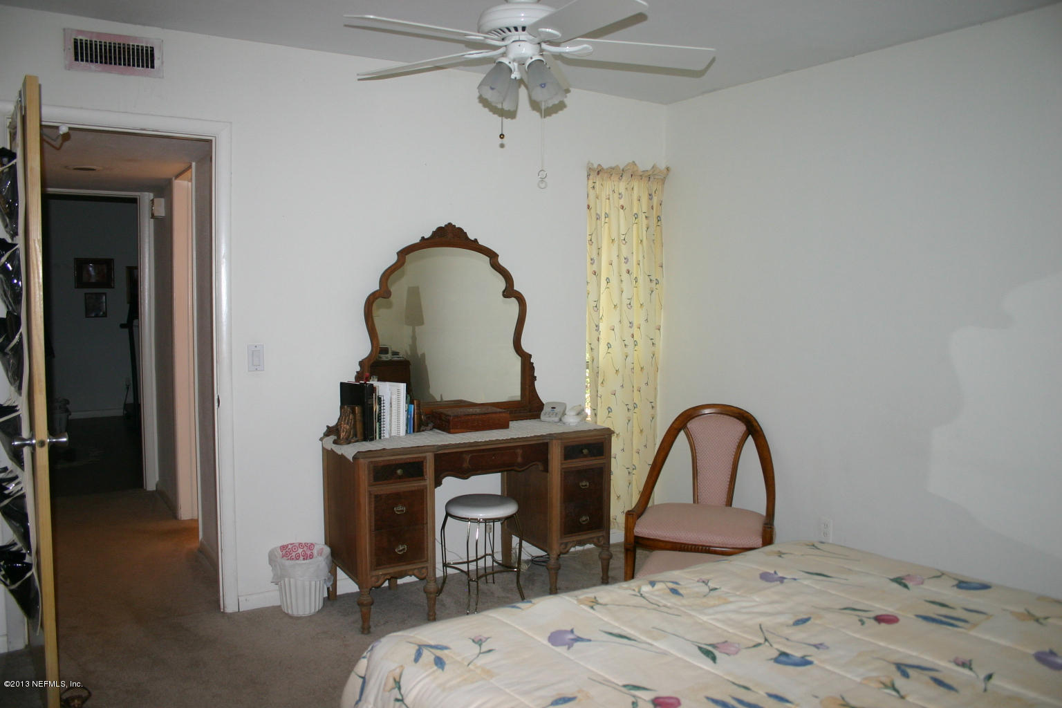 3969 Heidi Road Jacksonville, FL 32277 - Photo 12 of 29 a bedroom with a bed and a table