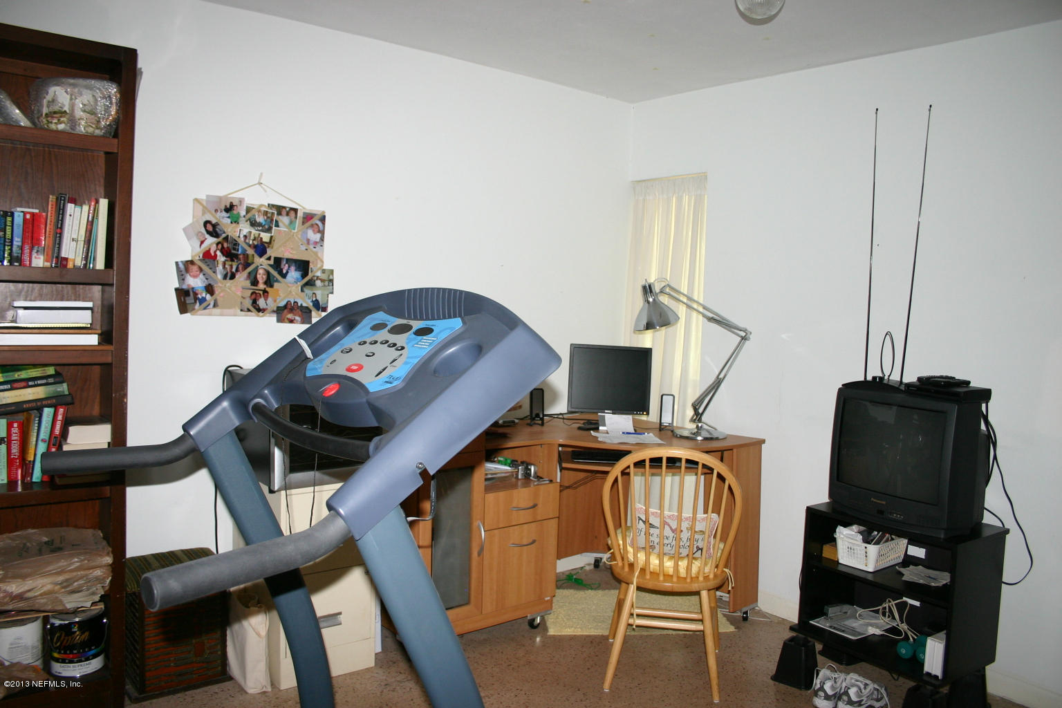 3969 Heidi Road Jacksonville, FL 32277 - Photo 15 of 29 a view of a workspace with furniture and a flat screen tv