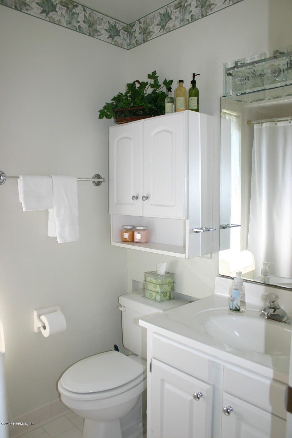 3969 Heidi Road Jacksonville, FL 32277 - Photo 19 of 29 a bathroom with a granite countertop toilet sink and mirror