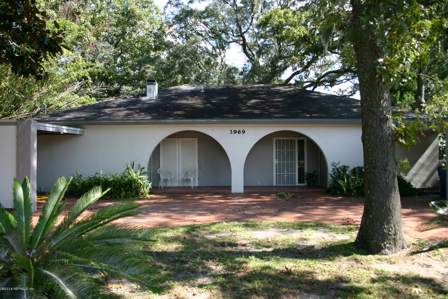 3969 Heidi Road Jacksonville, FL 32277 - Photo 2 of 29 a front view of a house with garden