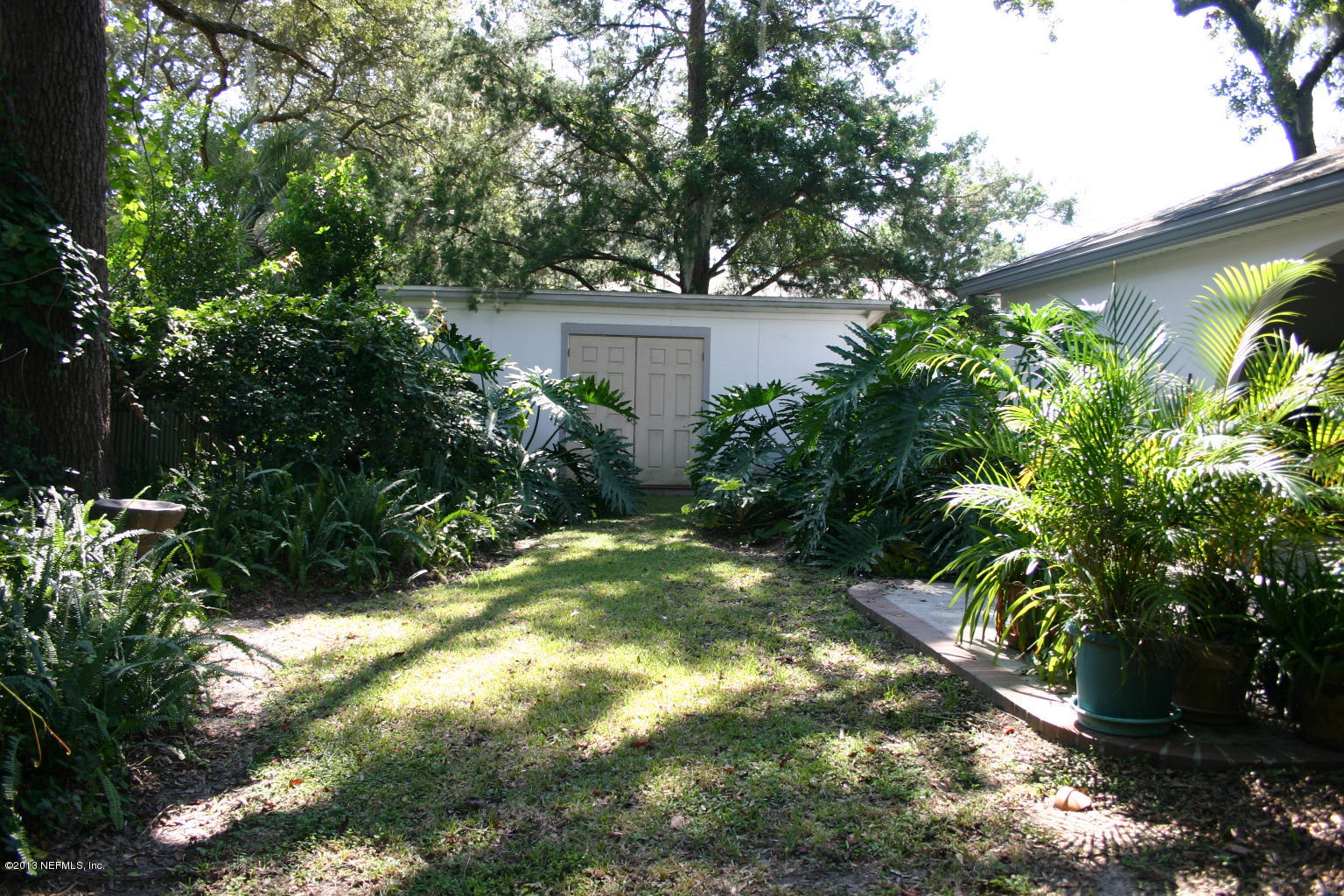 3969 Heidi Road Jacksonville, FL 32277 - Photo 22 of 29 a backyard of a house with lots of green space