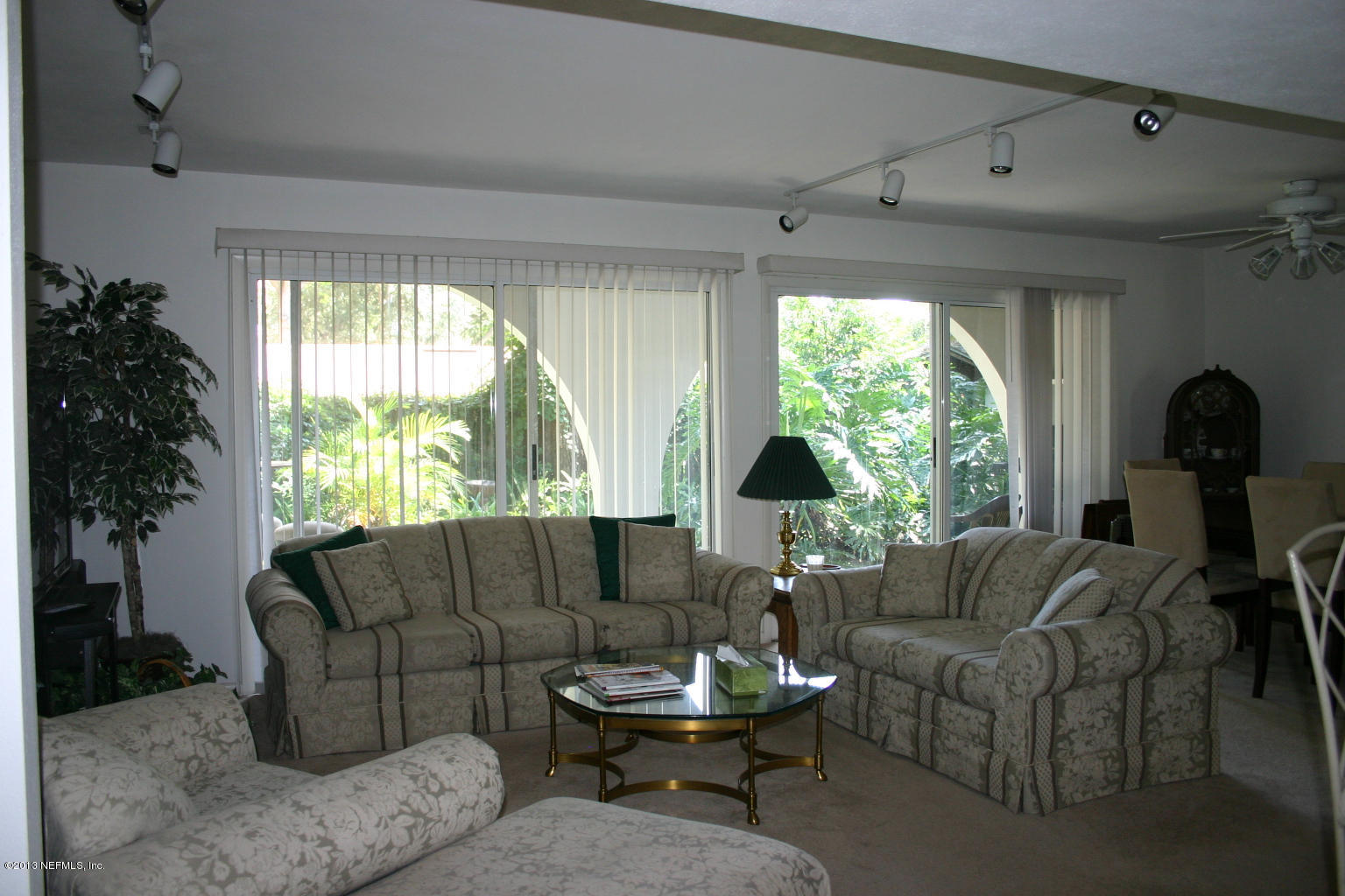 3969 Heidi Road Jacksonville, FL 32277 - Photo 3 of 29 a living room with furniture and a large window