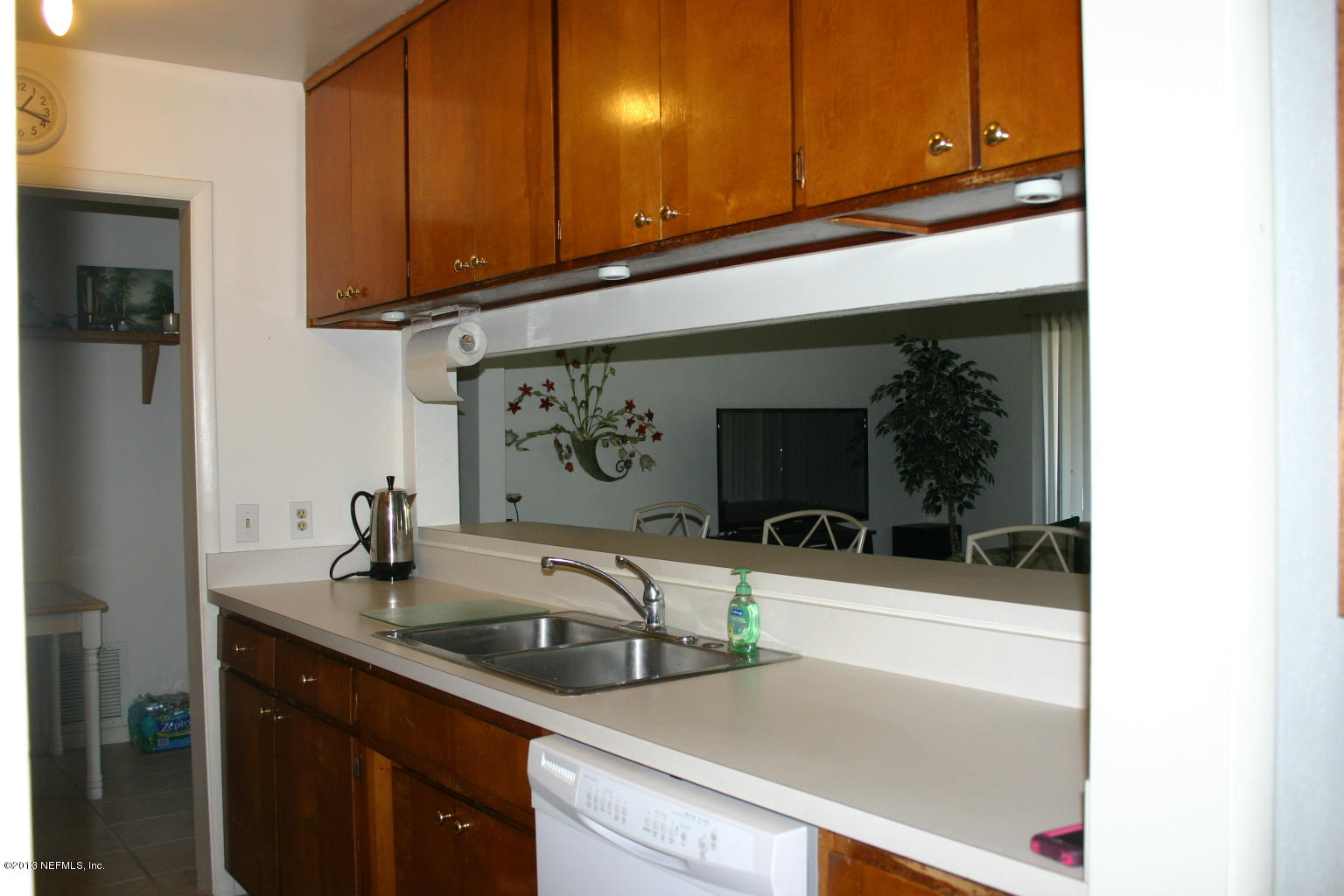 3969 Heidi Road Jacksonville, FL 32277 - Photo 6 of 29 a kitchen with a sink and a refrigerator