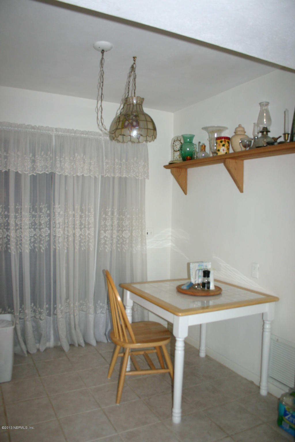 3969 Heidi Road Jacksonville, FL 32277 - Photo 8 of 29 a table and chairs in a kitchen