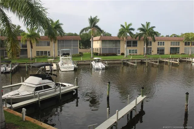 a view of a house with swimming pool and sitting area