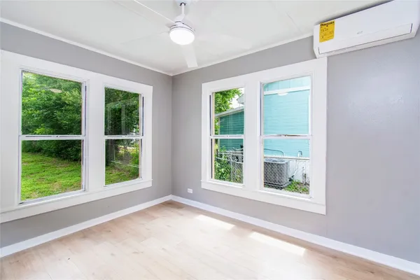 a view of a room that has a window in it