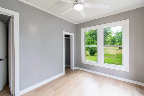 a view of a room with a large window with outer view
