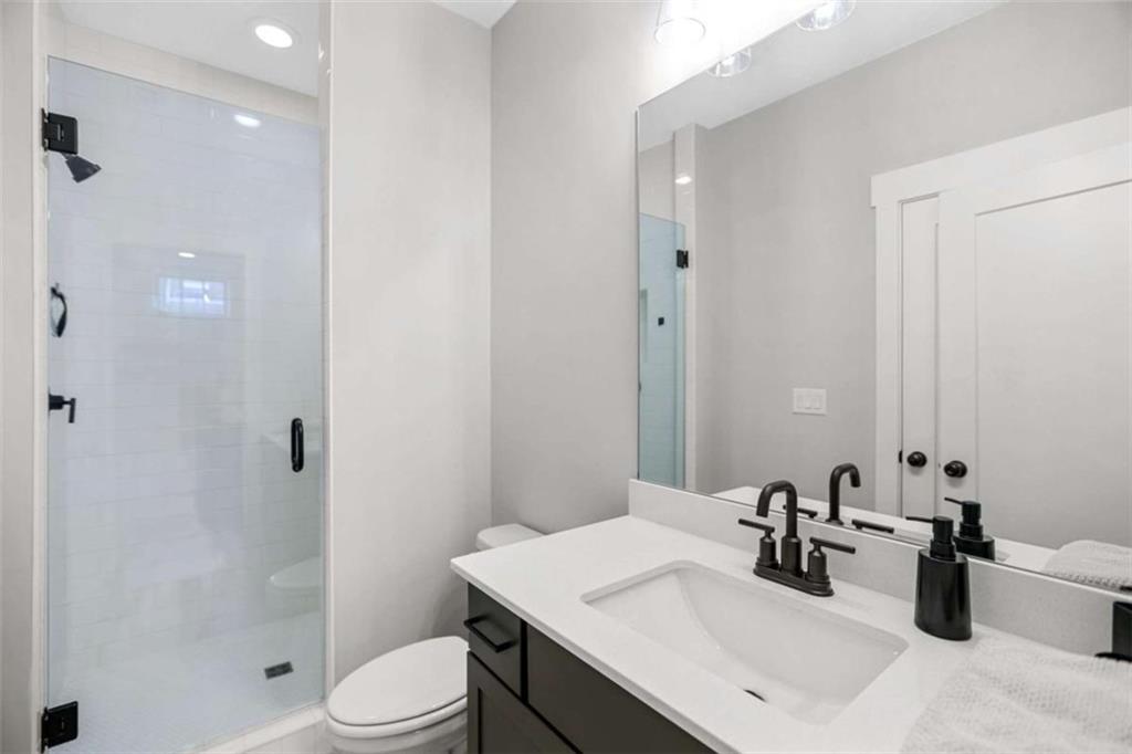 4466 Lemon Street Acworth, GA 30101 - Photo 33 of 65 a bathroom with a sink toilet and shower