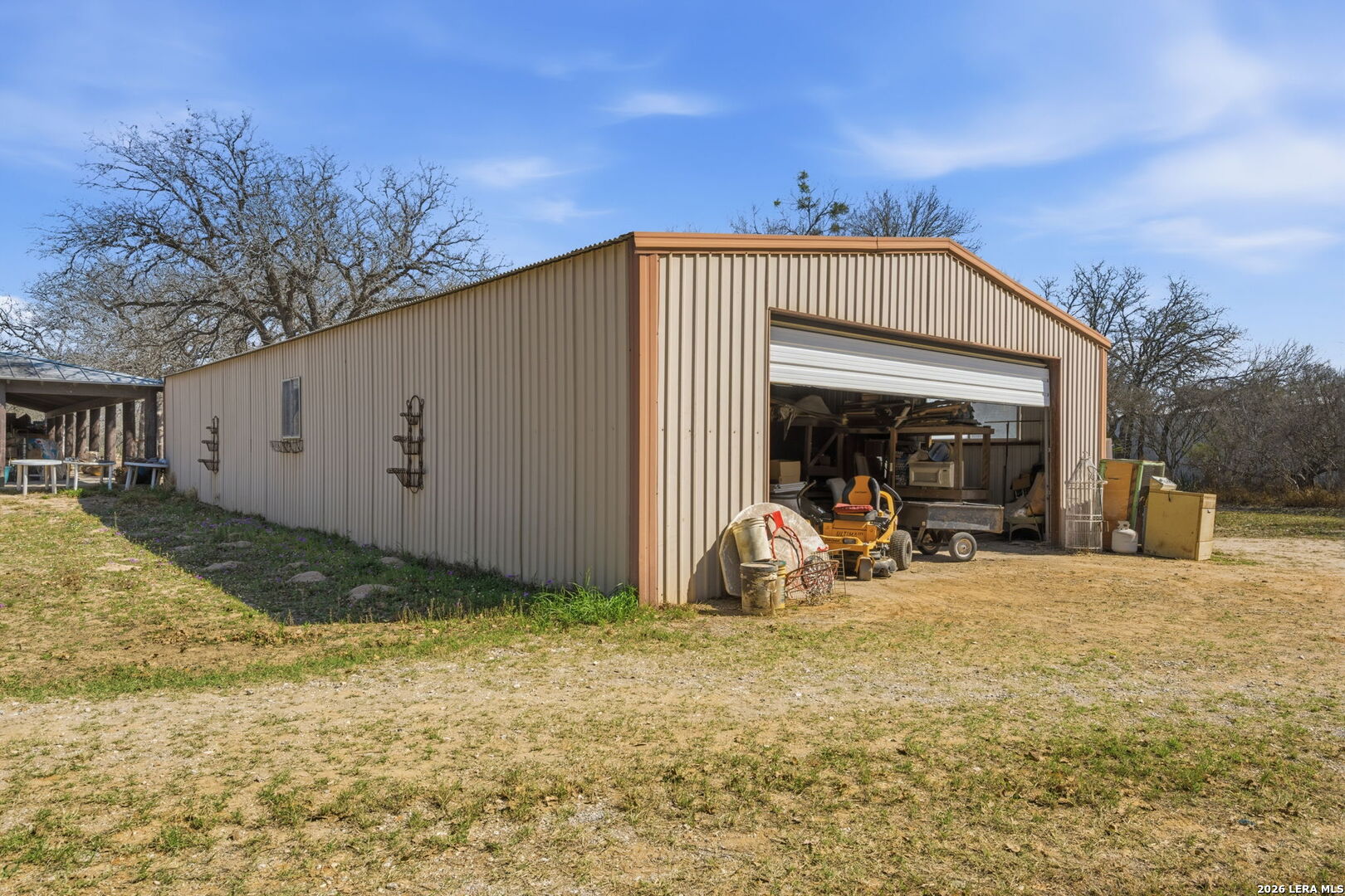 1150 Bruce Road Poteet, TX 78065 - Photo 31 of 33 a view of a house with backyard and sitting area