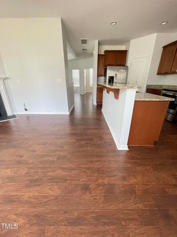 a view of a kitchen with wooden floor