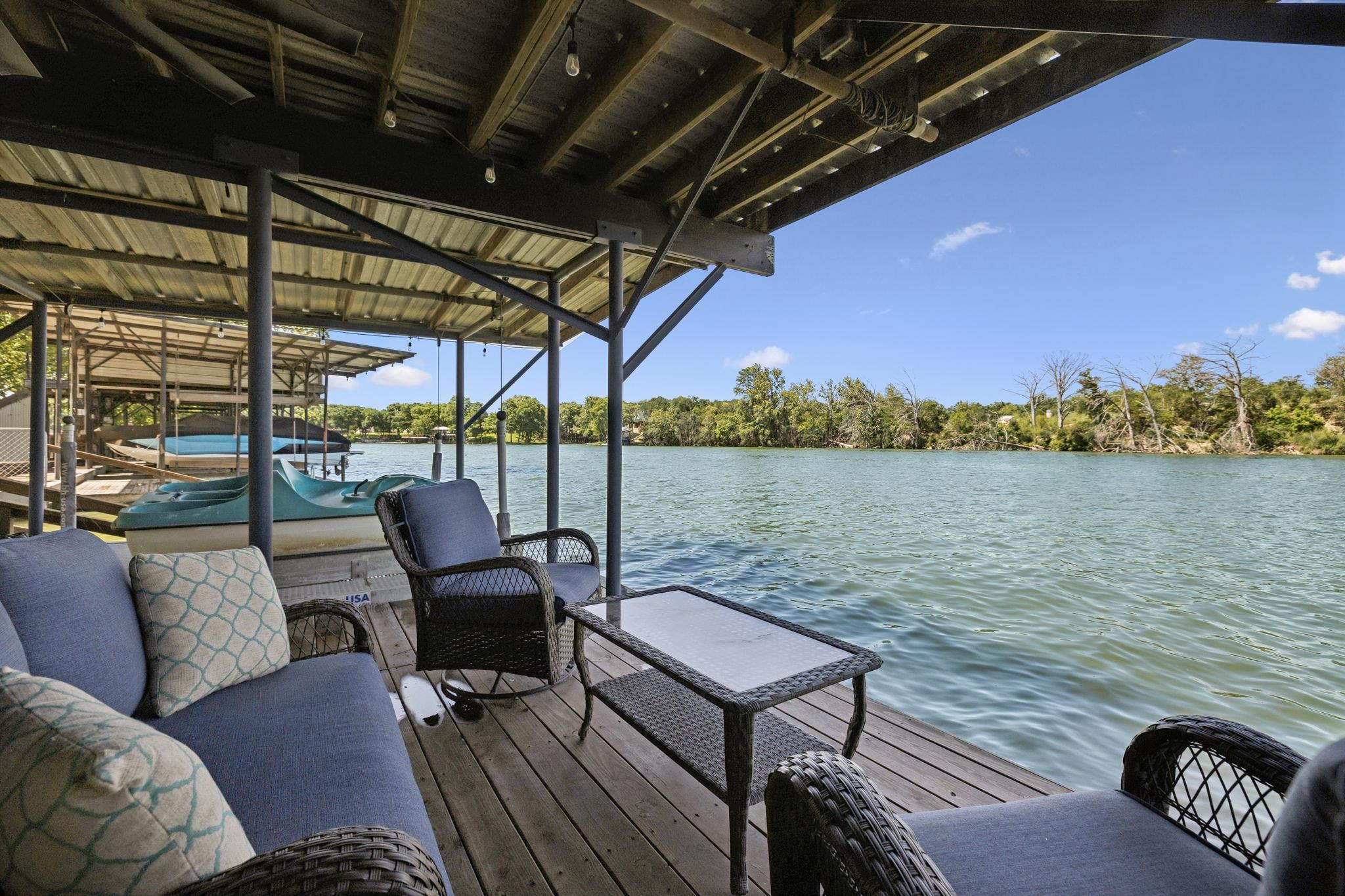 1435 East Zipp Road New Braunfels, TX 78130 - Photo 8 of 43 a roof deck with a table and chairs
