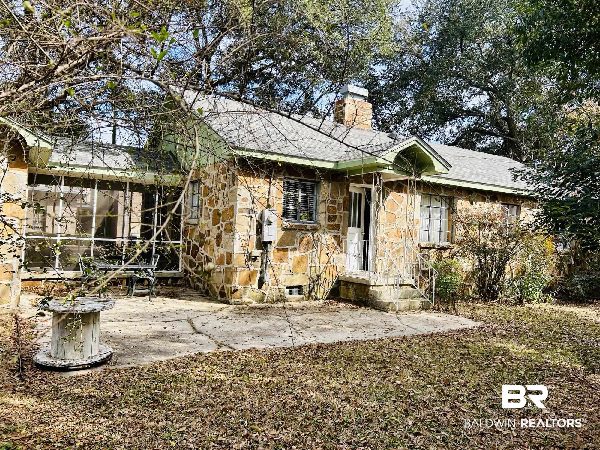 94 Diamond Street Mobile, AL 36611 - Photo 24 of 30 Back of house with a sunroom and a patio area