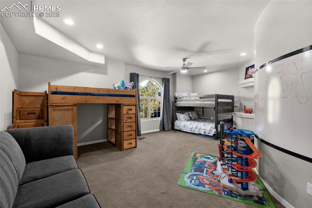 17502 Abert Ridge View Colorado Springs, CO 80908 - Photo 25 of 50 Bedroom featuring recessed lighting, baseboards, carpet, and ceiling fan