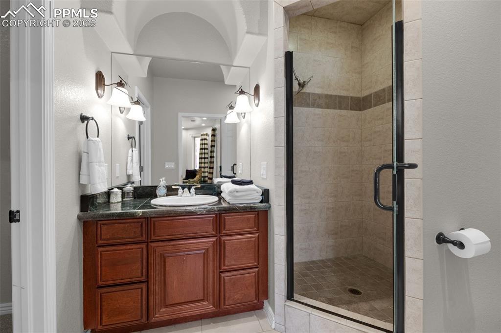 17502 Abert Ridge View Colorado Springs, CO 80908 - Photo 37 of 50 Full bath featuring a shower stall and vanity