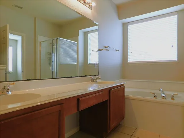 a bathroom with a bathtub and a sink
