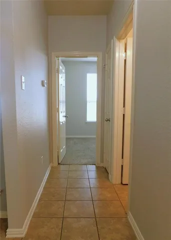 an empty room with closet area