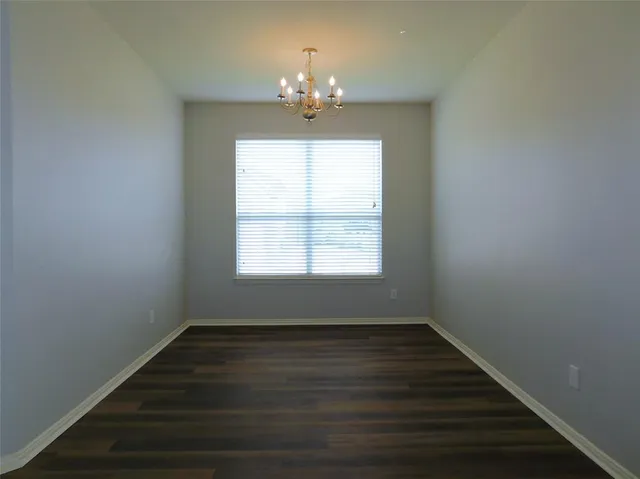 a kitchen with stainless steel appliances granite countertop a refrigerator and a stove