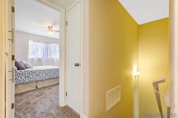 a view of a bathroom with a sink and mirror